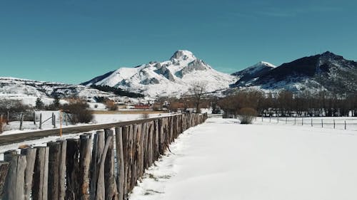 Drone Footage of a Road and a Town in a Winter Landscape