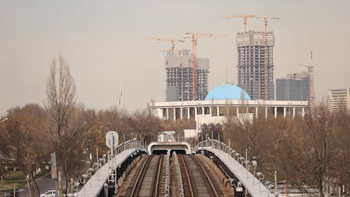 Time Lapse of Construction Sites and Passing Trains in the City