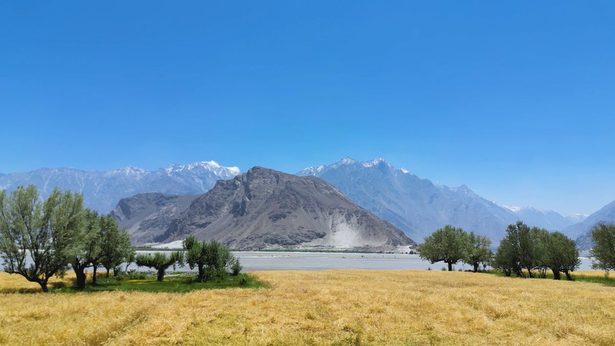 A Beautiful Mountain Landscape under a Clear Blue Sky Free Stock Video ...