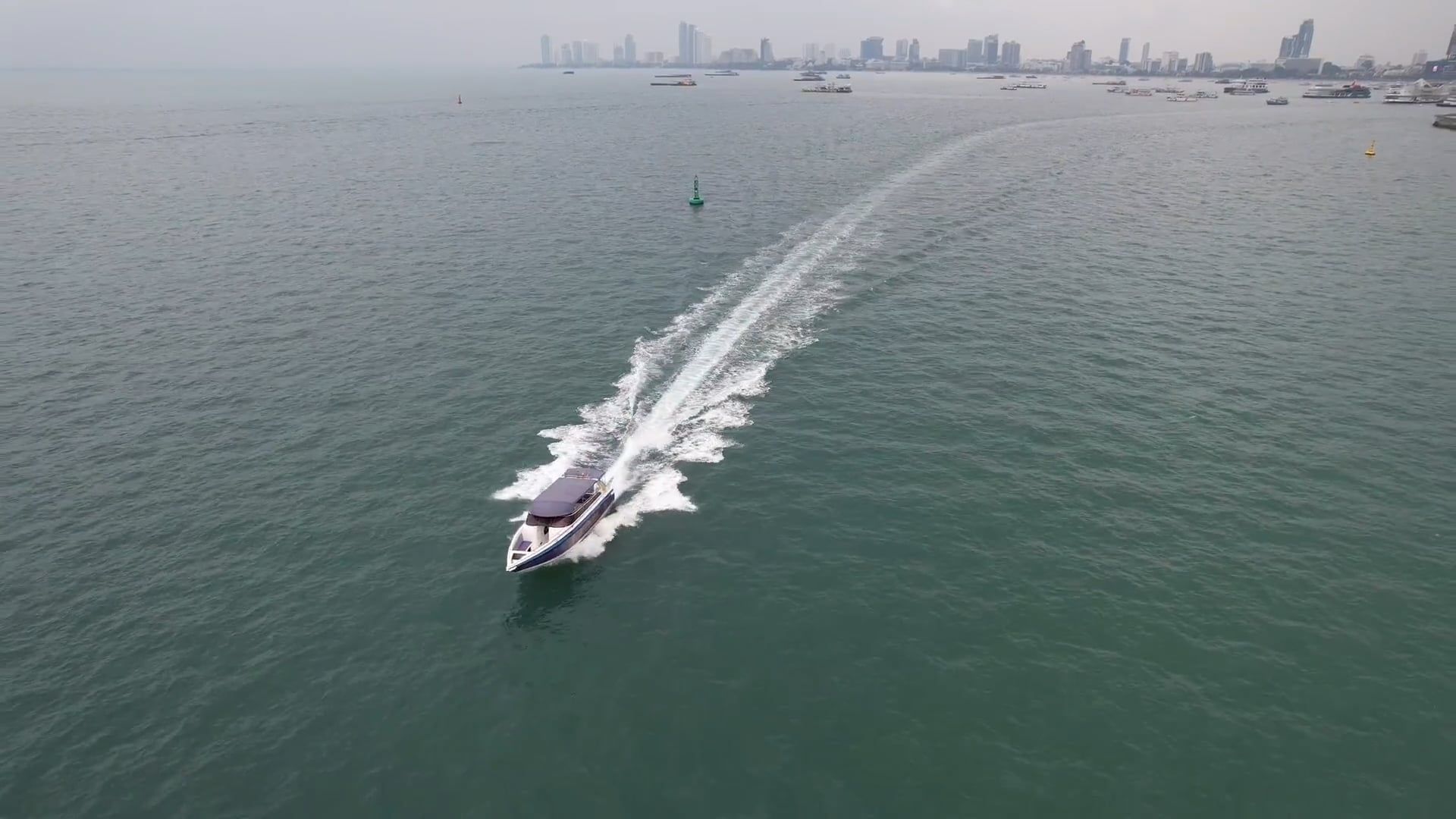 A Motorboat Leaving a Wake on the Sea Surface near the Coast Free Stock ...