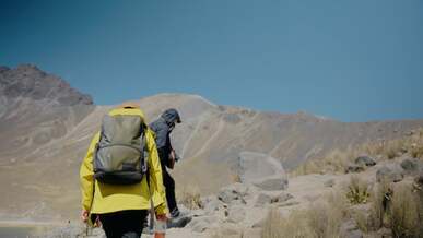 a group of hikers in a mountain landscape