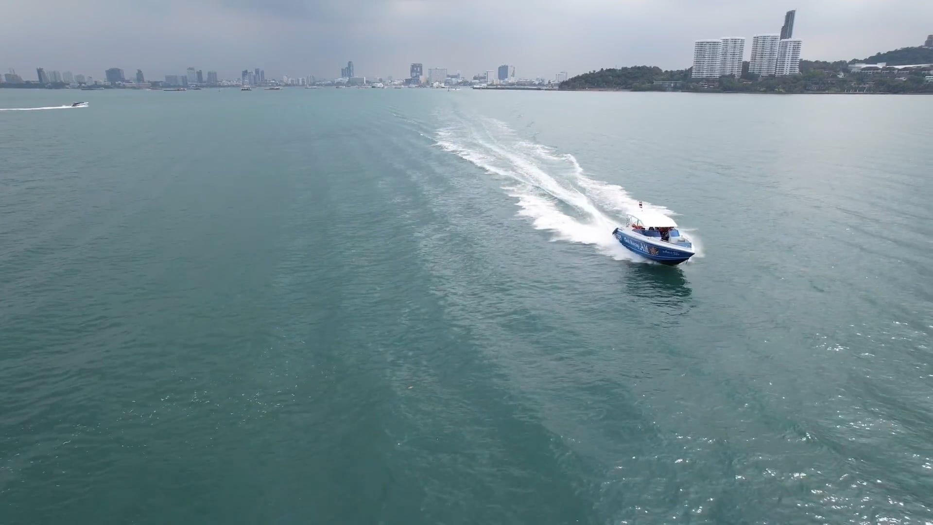 Drone Video of a Motorboat Leaving a Trail on the Sea Surface Free ...