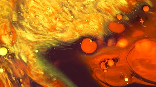 Close up of Colorful Liquids and Oil Mixing in Slow Motion 