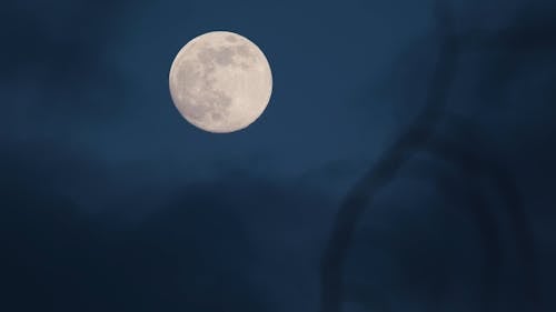 A Full Moon Surrounded by Dark Clouds 