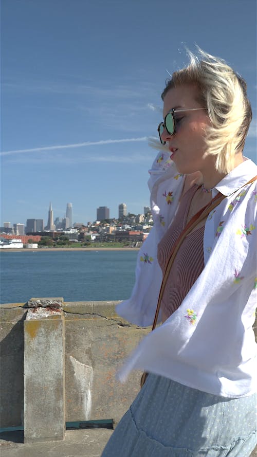 Young Woman Walking Happily on a San Francisco Pier
