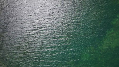 Top View of Calm Sea Waters and a Coastal City