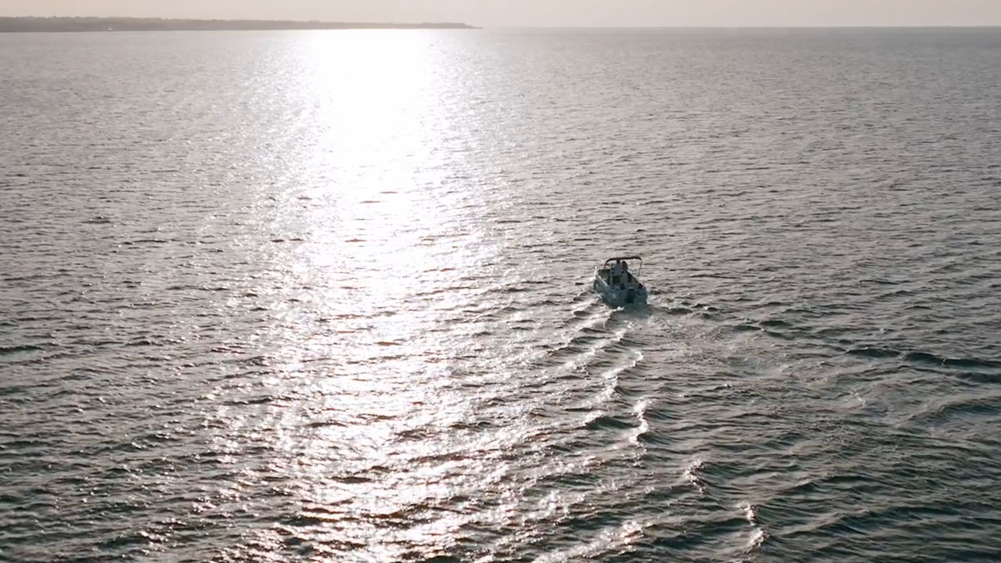 Drone Footage of a Motorboat on Calm Sea Waters Free Stock Video ...
