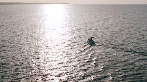 Drone Footage of a Motorboat on Calm Sea Waters 