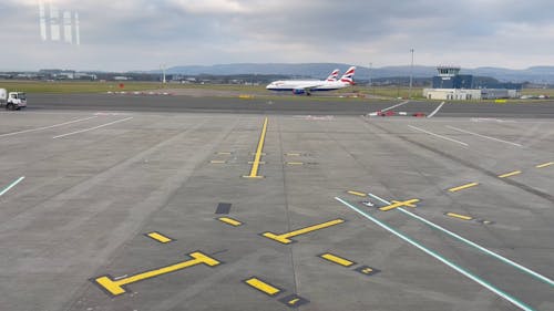 A Fuel Truck Driving along the Airport Apron 