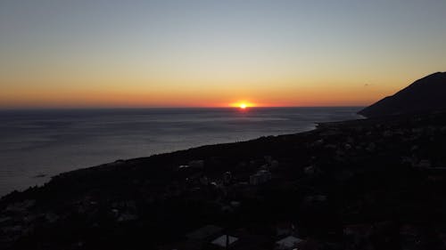 Drone Video of the Sun Setting over the Ocean