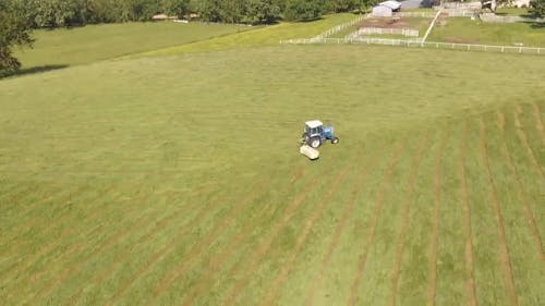 Cleaning The Field Using A Tractor