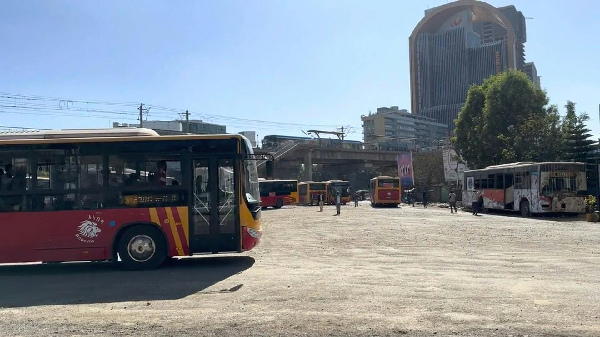 Buses and Passengers at Meskel Square Station in Addis Ababa, Ethiopia