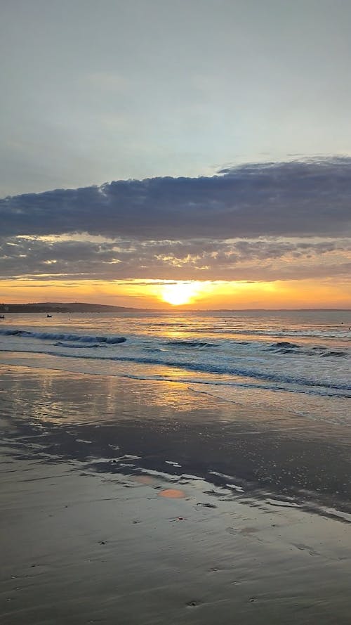 Silhouette of a Person in the Sea at Sunset 