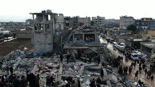 Drone Video of People Walking on Rubble after an Earthquake 