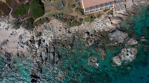 Top View of Coastal Rock Formations and Sandy Beaches 