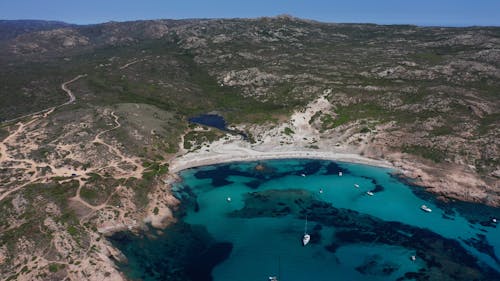 Aerial Footage of Boats in a Bay with Turquoise Waters