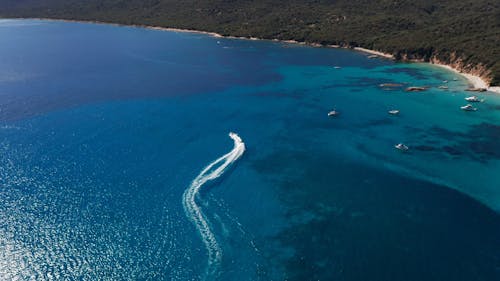 Drone Footage of Water Scooters on Blue Waters 