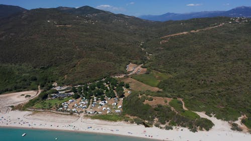 Green Mountains and Sandy Beaches on the Coast of Corsica Island