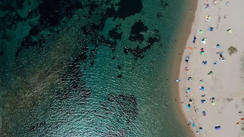 Top View of a Sandy Beach with Turquoise Sea Water