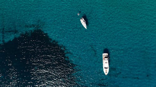 Top View of Yachts near the Coast and Tourists on a Sandy Beach 