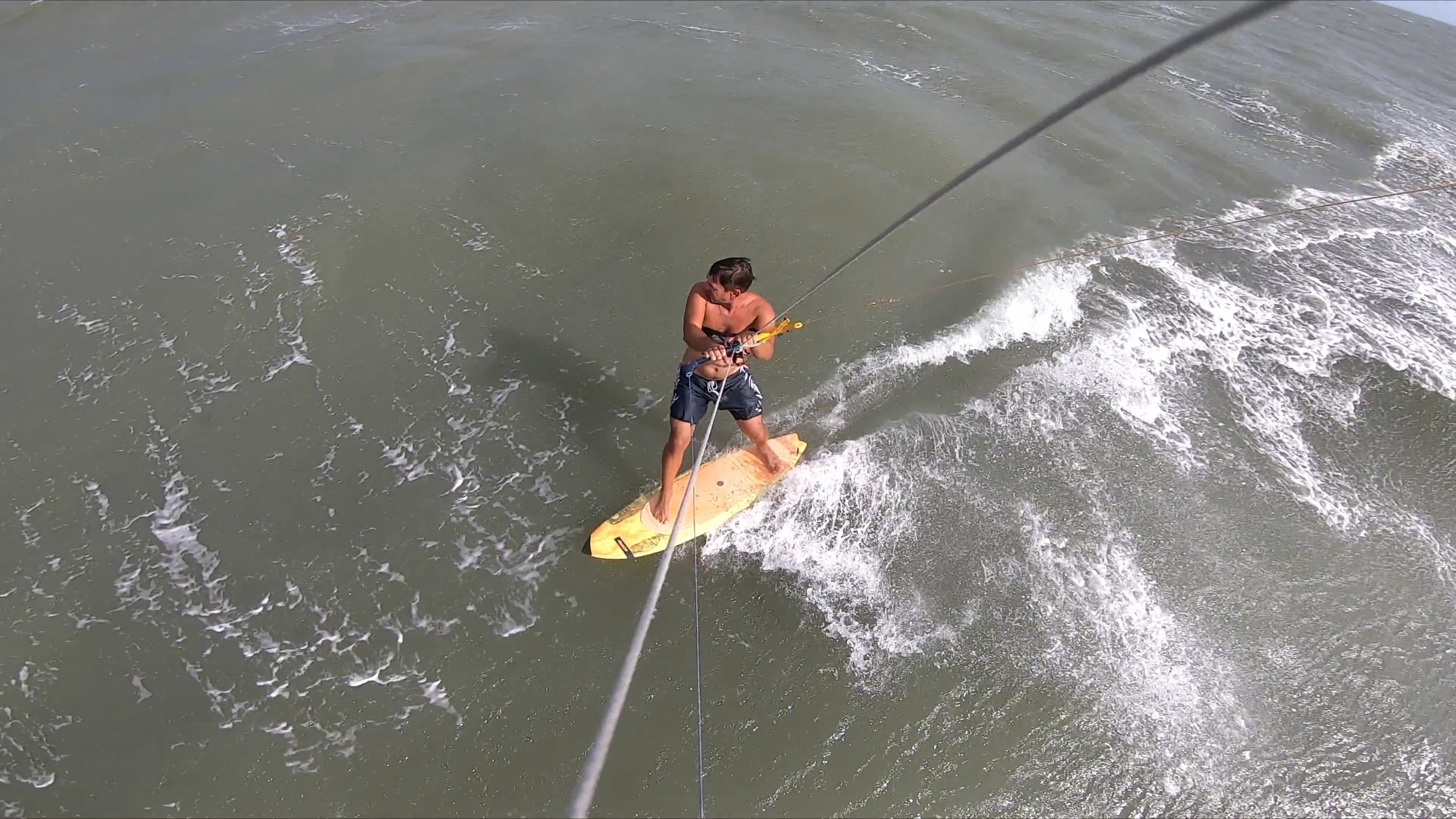 A person riding a surfboard in the ocean Free Stock Video Footage ...