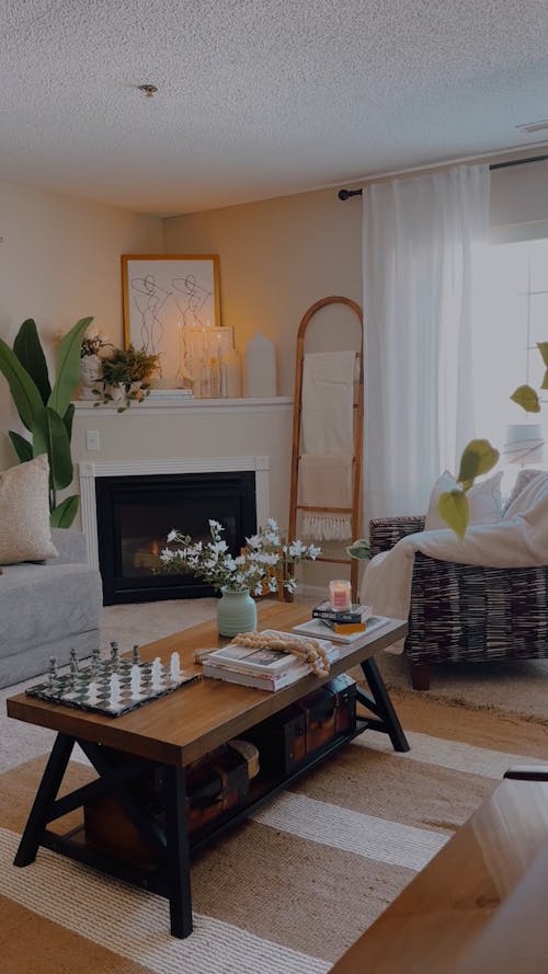 A Furnished Living Room with a Fireplace 