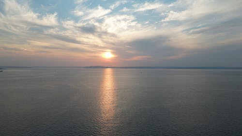 Drone Footage of a Dramatic Sunset Sky over the Ocean 