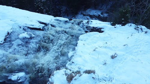 Drone View of a Waterfall in Winter Forest