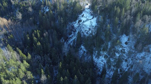 Aerial View of a Waterfall in Winter Forest