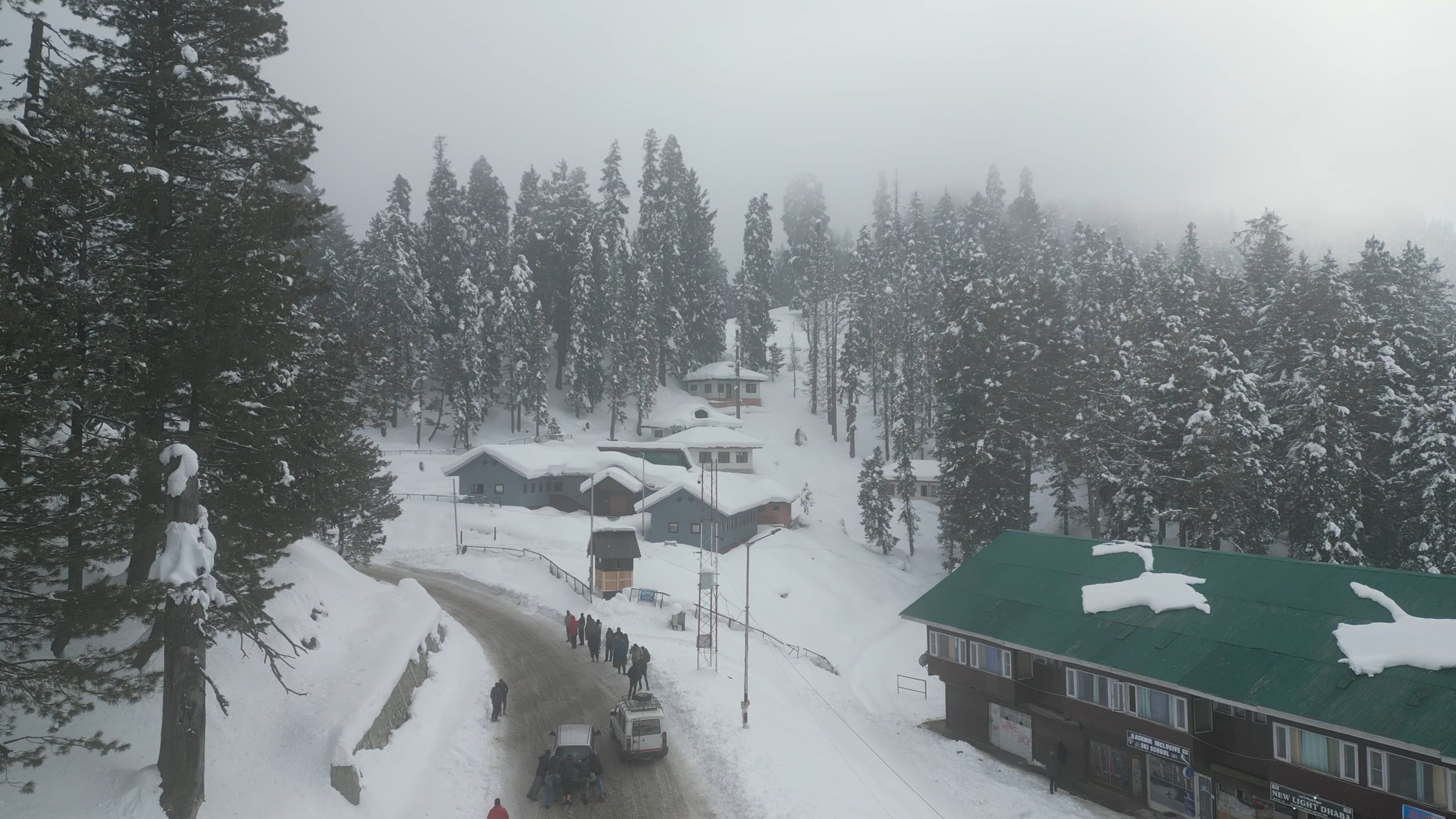 A snow covered area with trees and houses Free Stock Video Footage ...