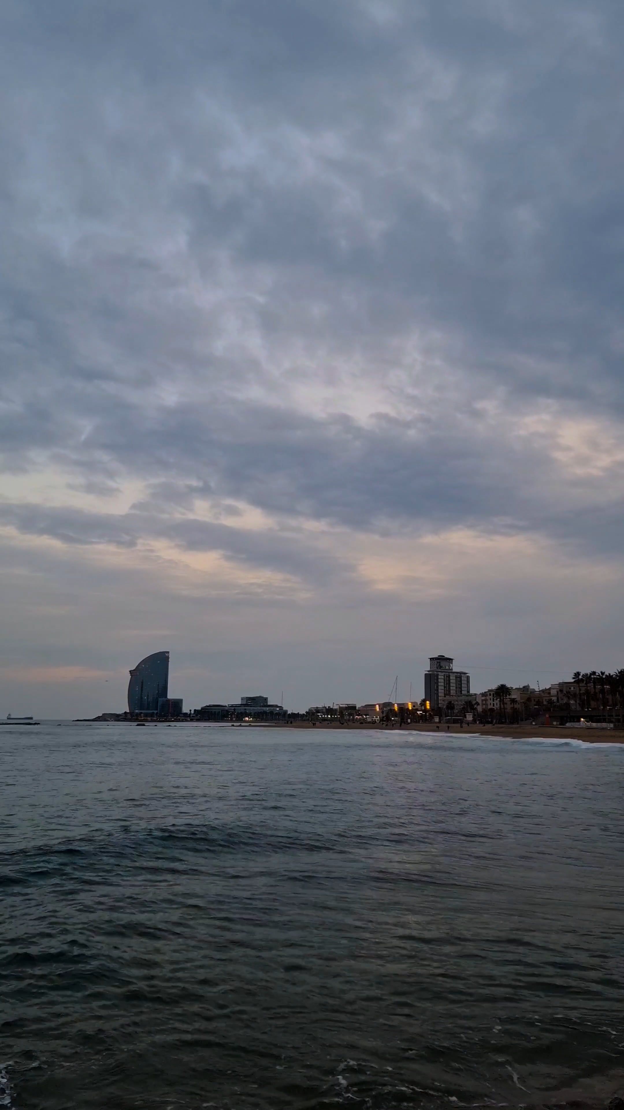 Time Lapse of Moving Clouds over a Coastal City at Dusk Free Stock ...