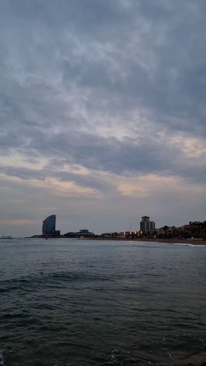 Time Lapse of Moving Clouds over a Coastal City at Dusk Free Stock ...