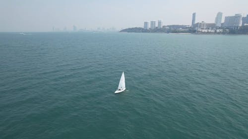 Drone Video of a Sailboat near the Coast of Pattaya City, Thailand 