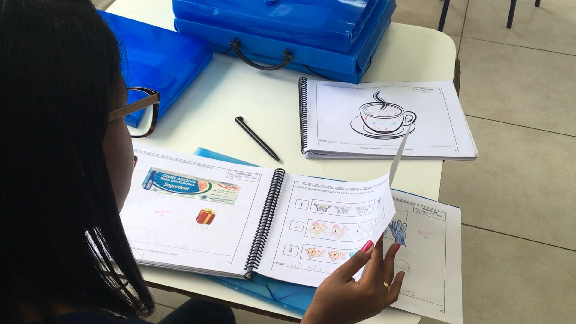 Teacher Checking On Coloring Books Of Students Free Stock Video Footage ...