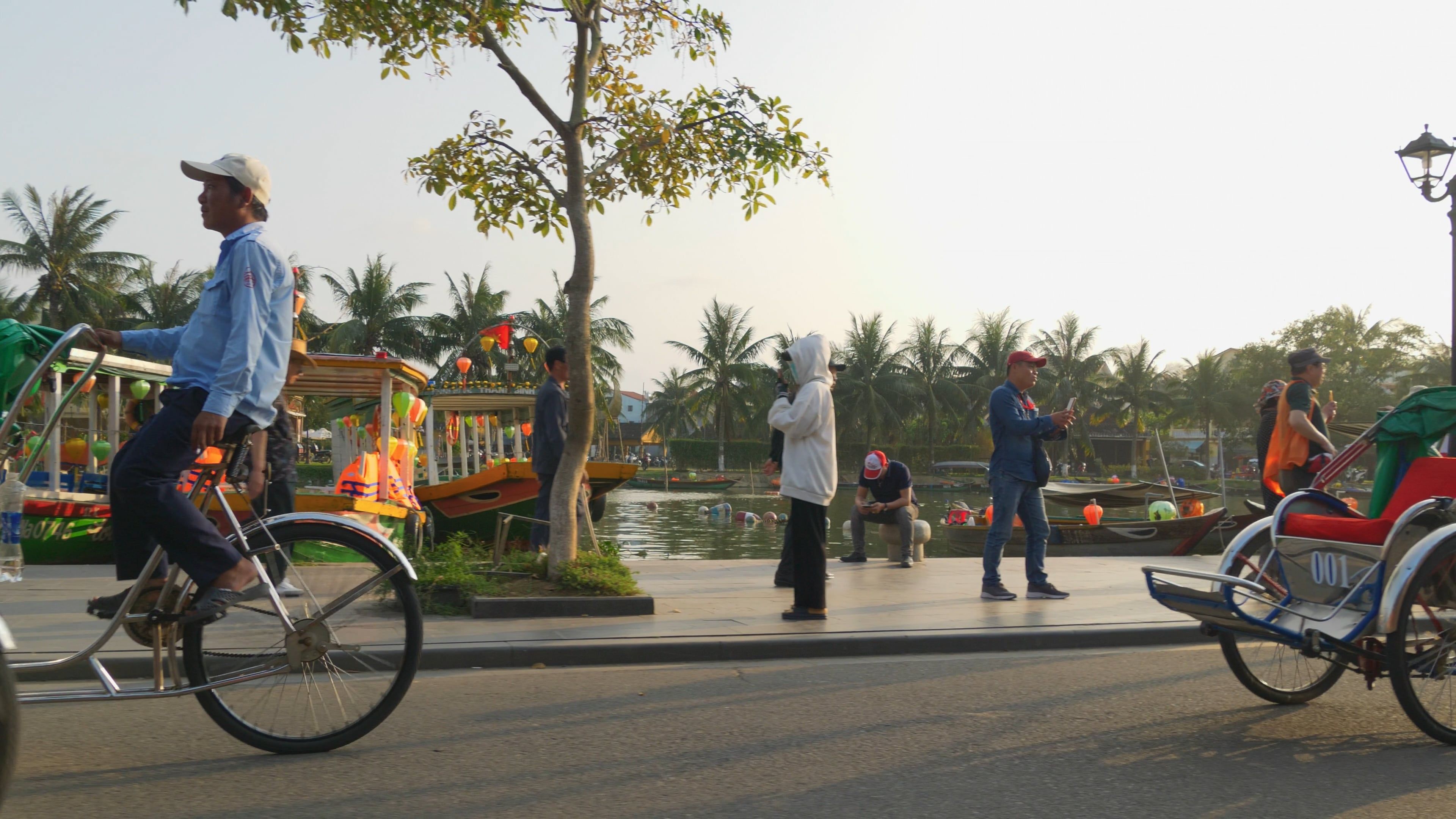 a man riding a bicycle with a man on the back 15815623 — free pexels stock footage