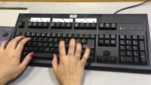 Hands In A Computer Keyboard