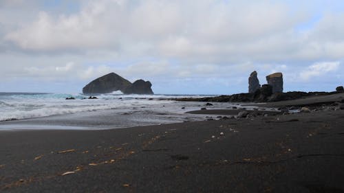 Volcanic rocks on Mosteiros dark beach in Portugal, Azores Islands