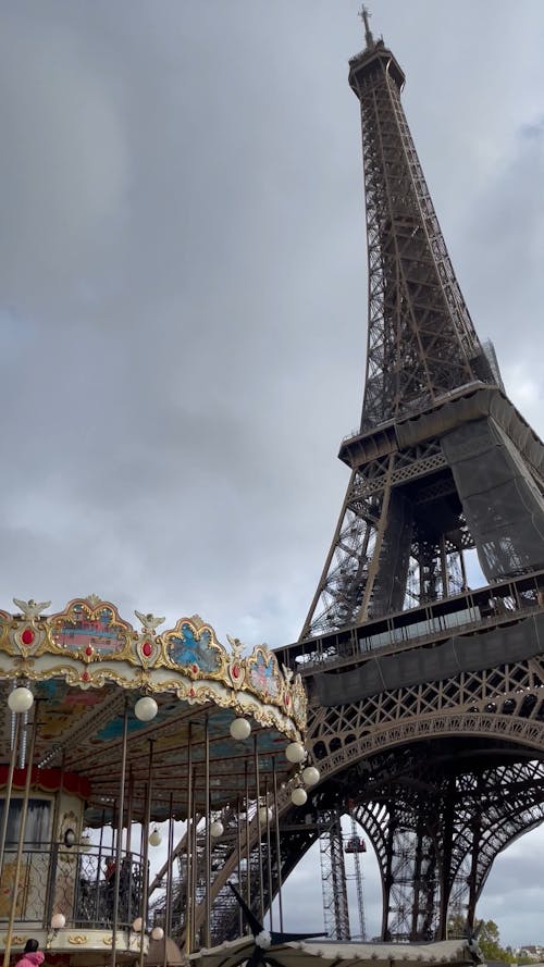 Carousel XI and the Eiffel Tower under a Cloudy Sky 