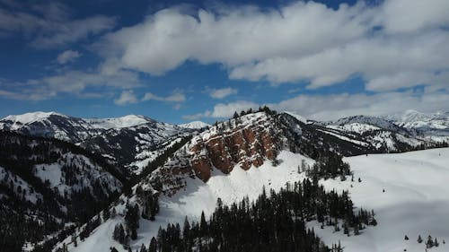 Drone Footage of a Snowy Mountain Range 