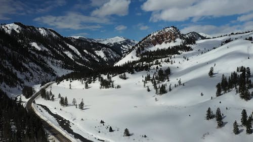 Drone View of a Snow Covered Mountain Slope 