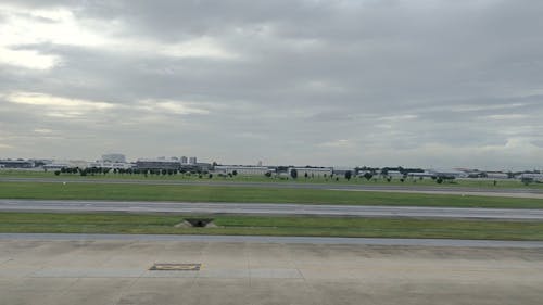 A Pushback Tug Towing a Plane 