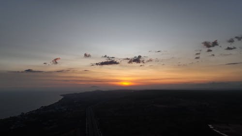 Drone Footage of a Coastal Area at Sunset 