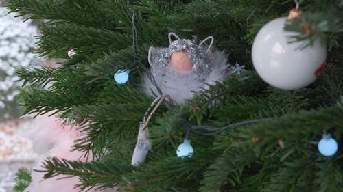 Close up of Decorations and Lights on a Christmas Tree