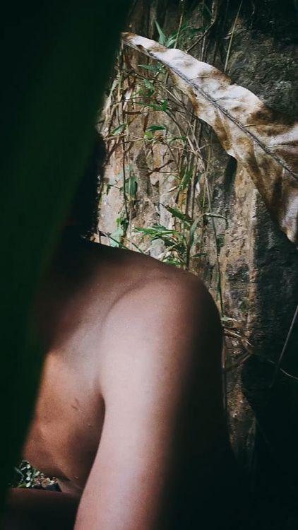 A Shirtless Man Posing with Flowers in his Hair Free Stock Video ...