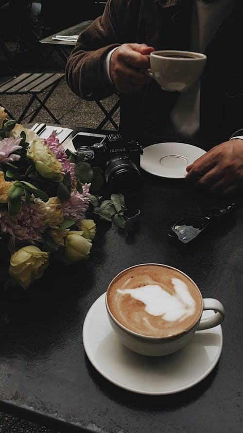 Having a Cup of Coffee at an Outdoor Cafe