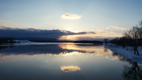 A Sunset Sky over the Lake in the Winter Season