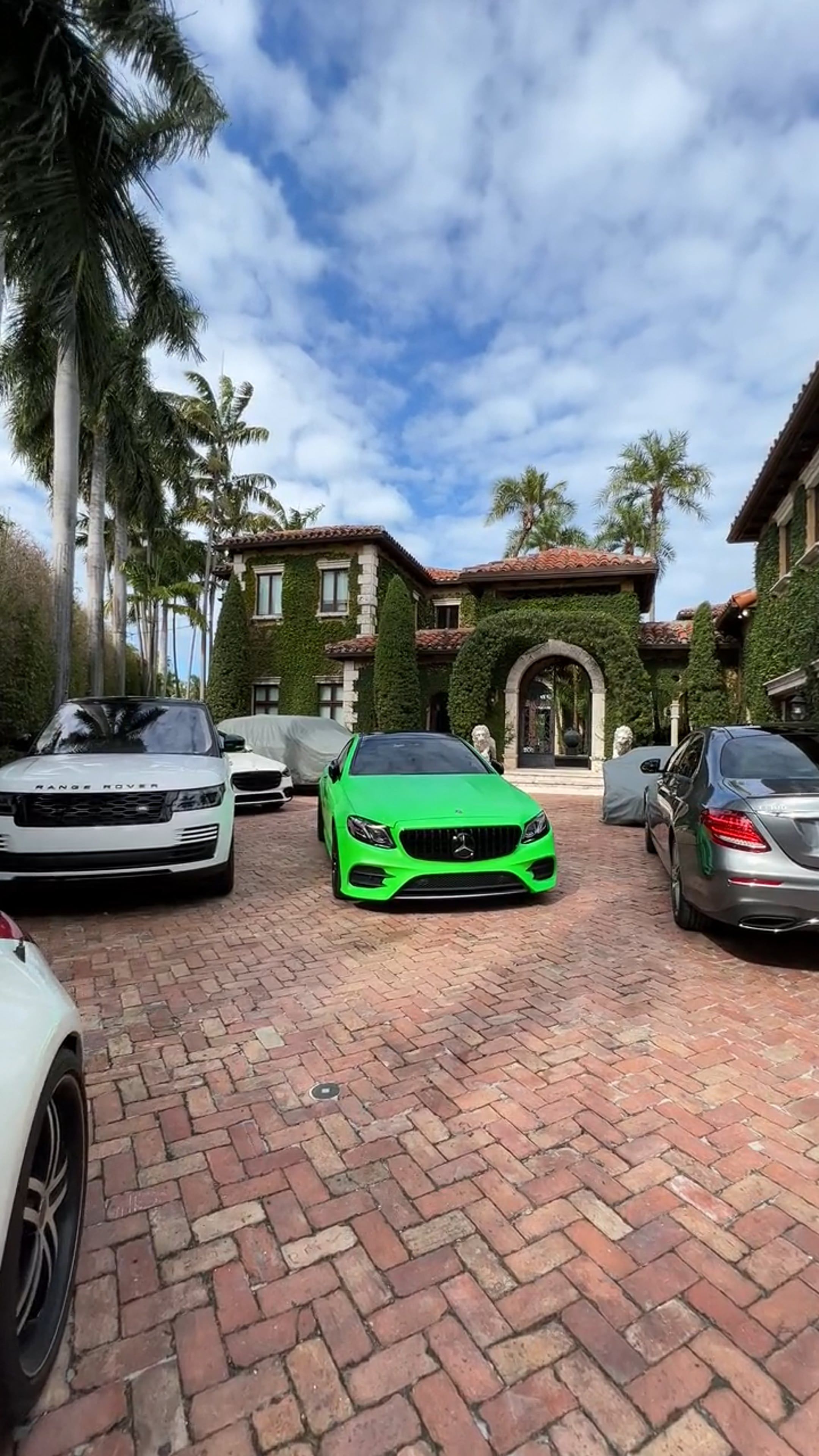 A green car parked in front of a house Free Stock Video Footage ...