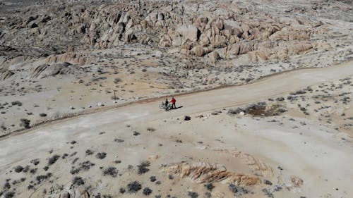Drone Video of Two Cyclists on a Dirt Road in Alabama Hills, California