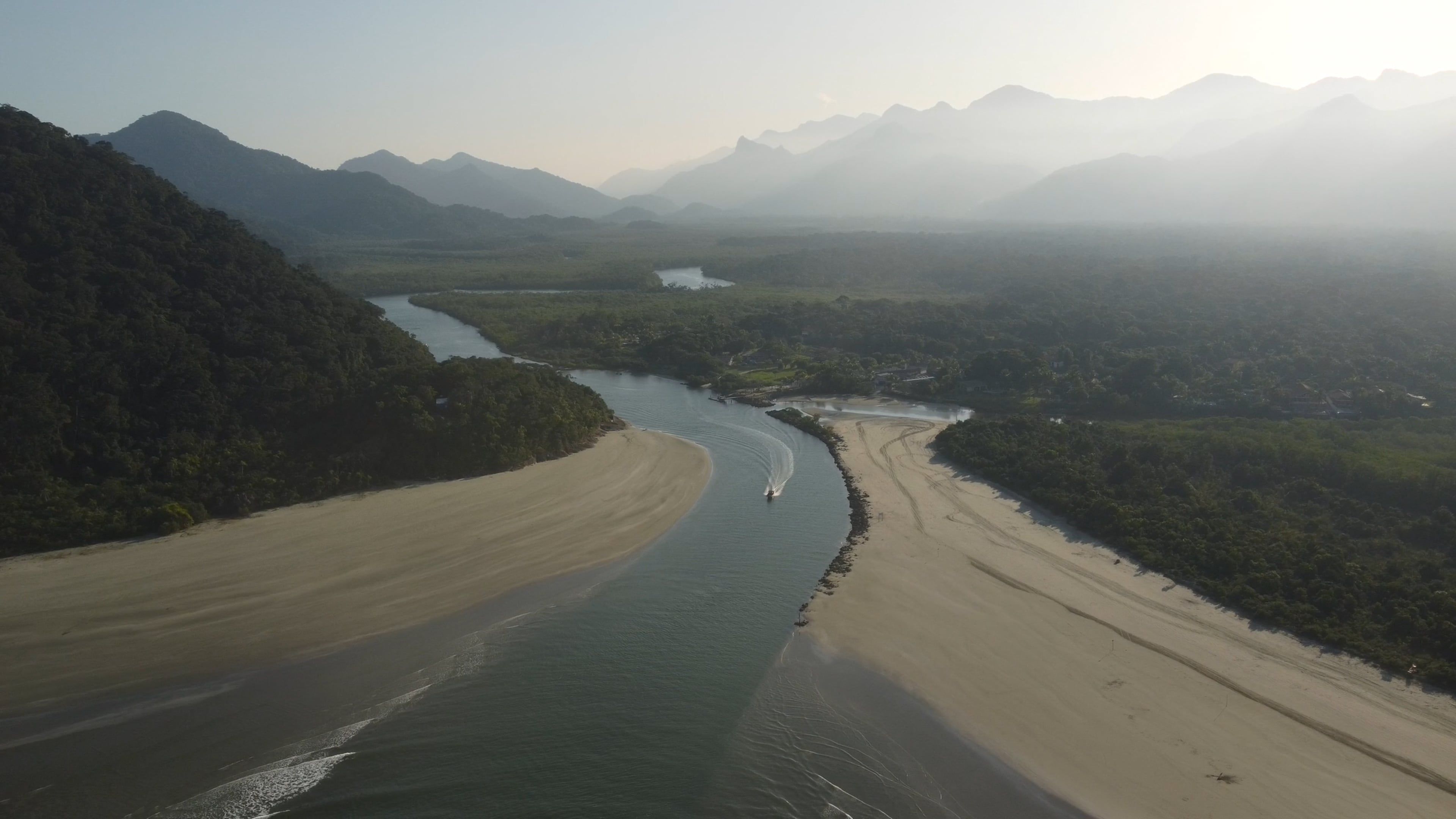 Drone Footage of a River and Green Mountains by the Sea Free Stock ...
