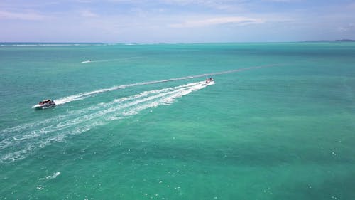 Drone Footage of Watercrafts on a Turquoise Sea 